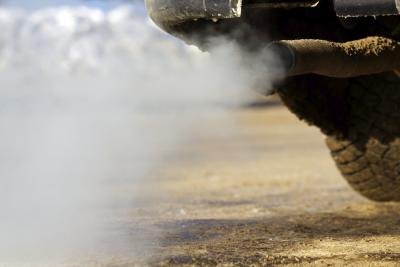 White exhaust smoke from truck tail pipe White exhaust smoke from truck tail pipe