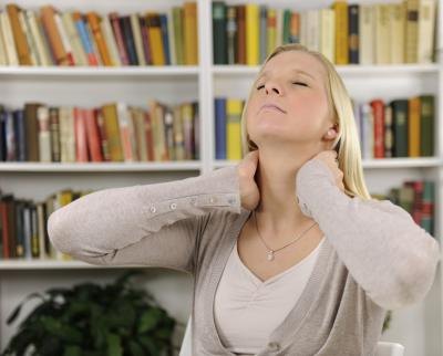 Woman with headache and neck pain due to arthritis. Woman with headache and neck pain due to arthritis.