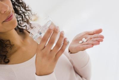 woman taking medicine
