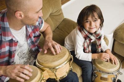 The teacher uses a drum to create a rhythm and asks children to make their feet do what the drum does.