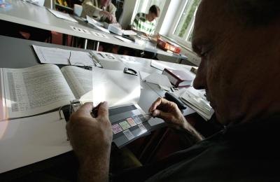 A collector examines stamps A collector examines stamps