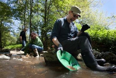 People panning for gold in river in Jamestown, CA.