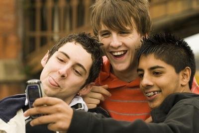Group of teen boys taking a photo Group of teen boys taking a photo