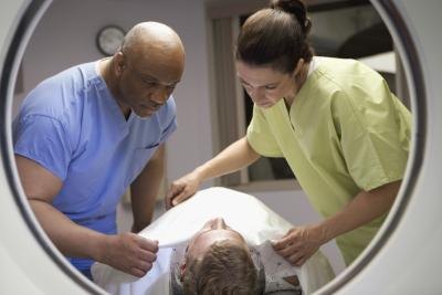 MRI technicians preparing patient
