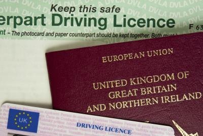 A driver's license or military card can suffice to establish employee identity.