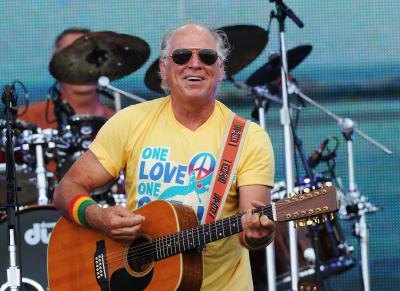 Jimmy Buffett performing on stage Jimmy Buffett performing on stage