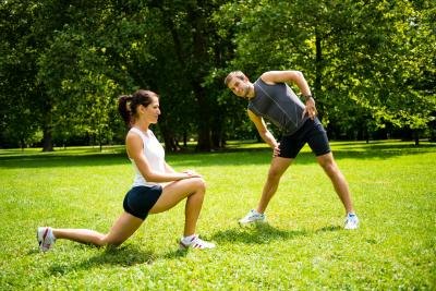 Stretching before exercise.