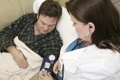 Nurse with patient at home.