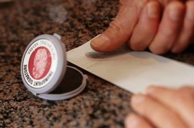 man taking fingerprints
