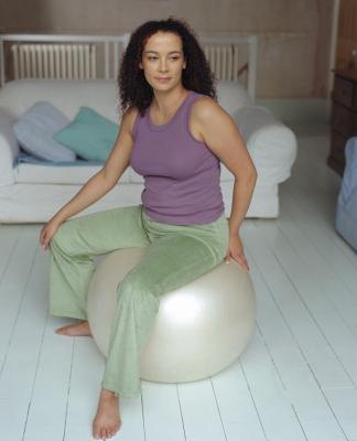 An exercise ball can help stretch your hips. An exercise ball can help stretch your hips.