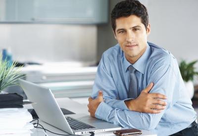 A Chief Financial Officer with his laptop. A Chief Financial Officer with his laptop.