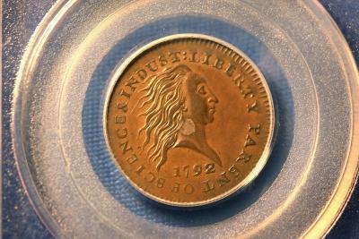 A 1792 U.S. Silver Center Cent in great condition is on display