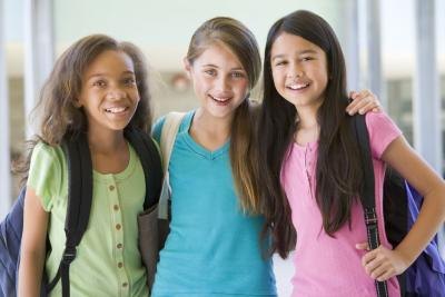 A group of preteen girls at school.