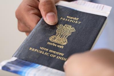 man handing passport over man handing passport over