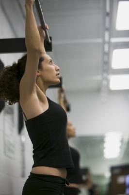 Hanging from a chin-up bar can keep your back healthy. Hanging from a chin-up bar can keep your back healthy.
