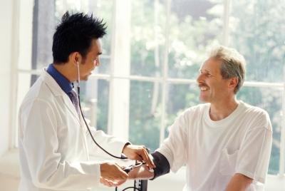 man speaking with doctor
