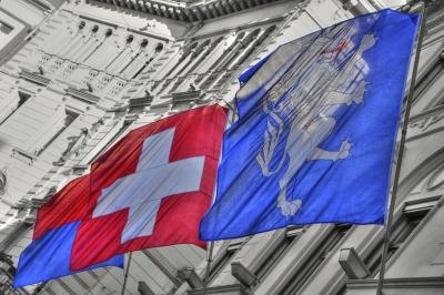 Swiss flags waving on building Swiss flags waving on building