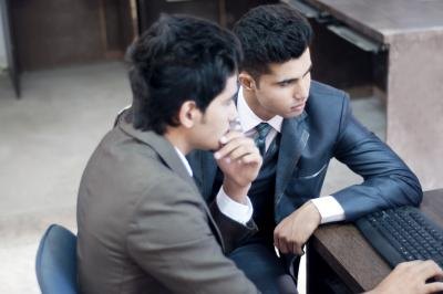 Businessmen looking at data