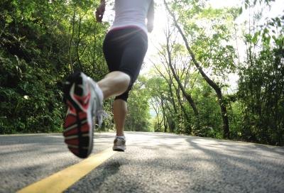Woman running on road
