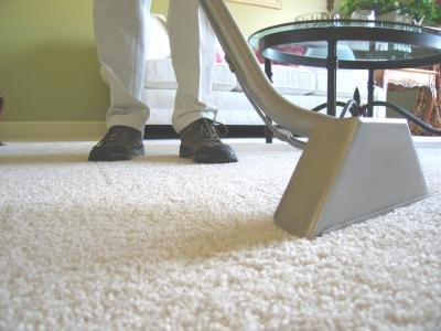 Carpet being cleaned with industrial vaccum