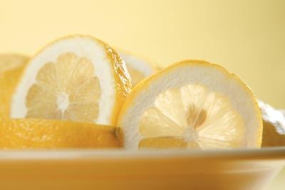 Slice a lemon into strips.