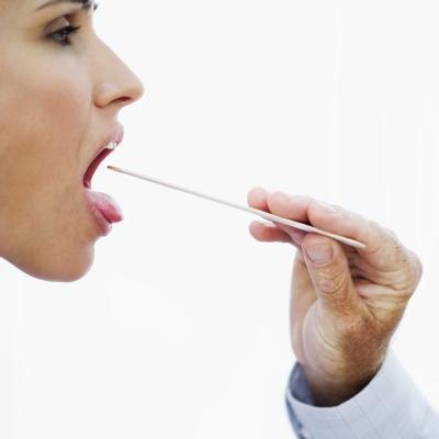 Examining throat.