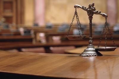 Scales of justice in a courtroom.