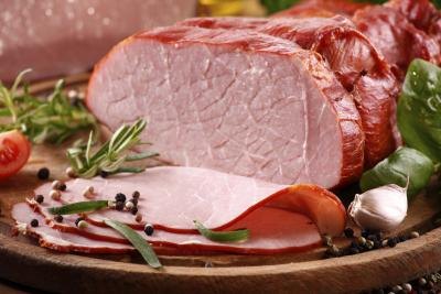 Sliced ham on cutting board.