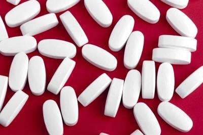 Magnesium supplements on a red background