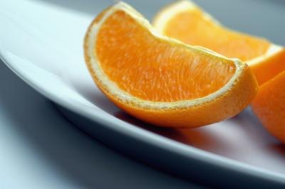 Orange wedges on a plate.