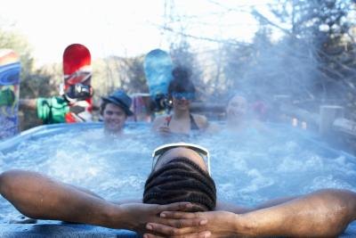 Young people enjoying the hot tub