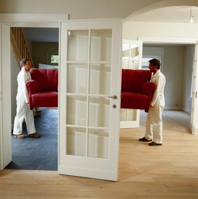 Men remove sofa from house