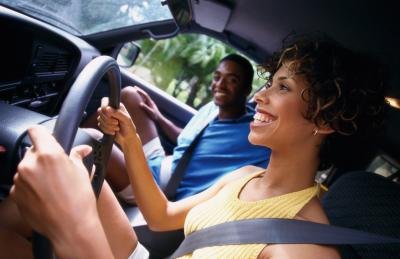 Couple driving over rolling scales