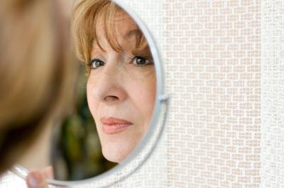 Woman looking in mirror