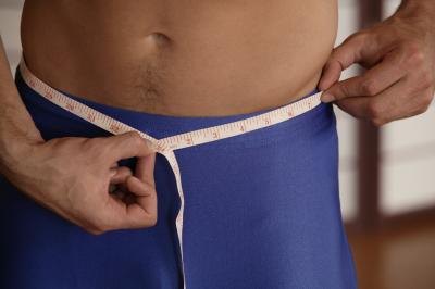 Use a measuring tape to measure different parts of your body to calculate your body fat percentage.
