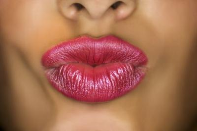 Make your mouth into an "o".