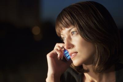 woman on phone while alone at night