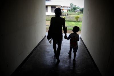 Mother with child in hallway