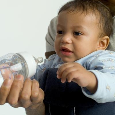 Bottle feed baby.