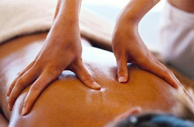A woman gets a back massage.