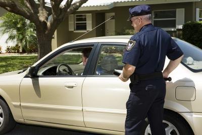Ask to see the officer's badge.