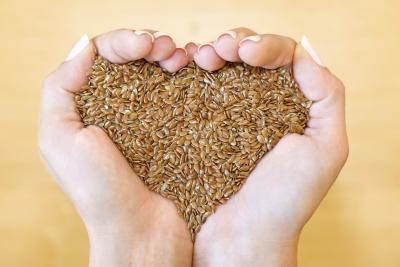 Flaxseeds in a woman's hands.
