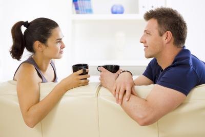 Couple talking on couch Couple talking on couch