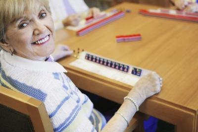 woman with Mahjong tiles