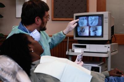 Dentist explaining diagnostic images.