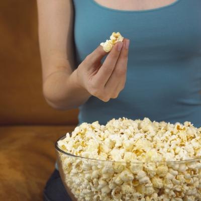 Woman eating popcorn