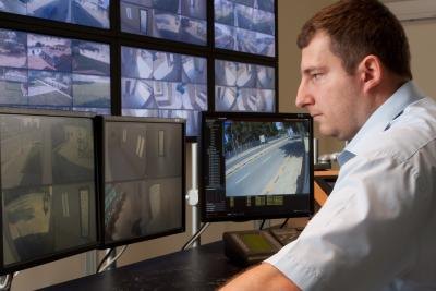 Security officer watching security cameras