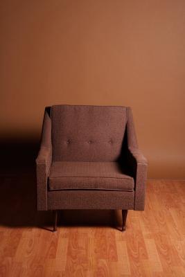Wood floors complement brown walls and furniture.