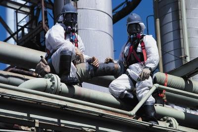 Asbestos removal team at industrial site