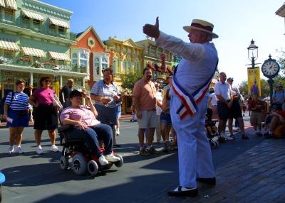 Guest listen to actor on Main Street USA at Disney's Magic Kingdom